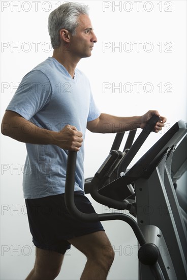 Man exercising on Stairmaster.