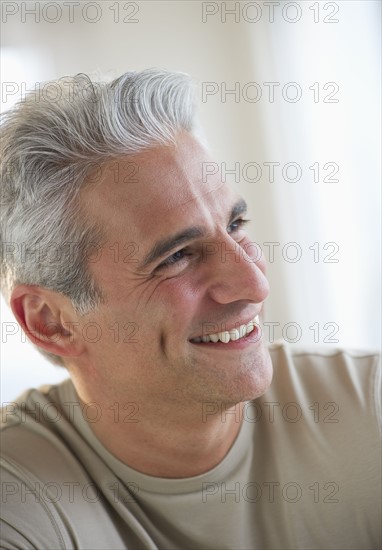 Portrait of a grey haired man.