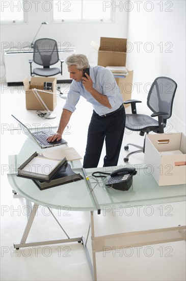 Businessman working in new office.