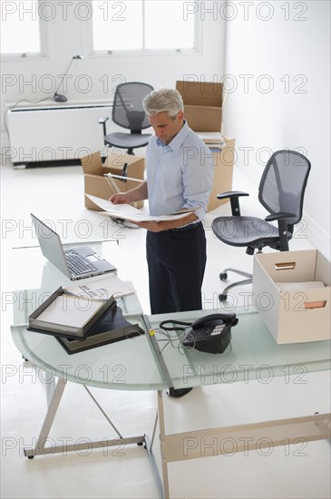 Businessman working in new office.