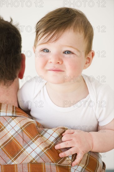 Father holding child. Photo : Jamie Grill