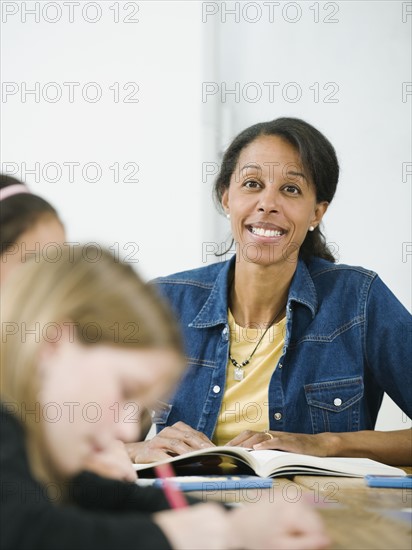 Elementary school teacher in classroom.