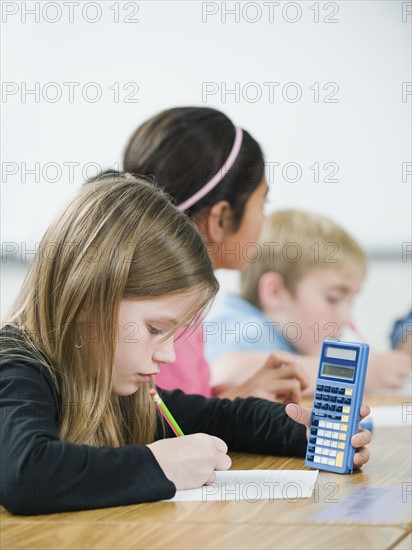 Students doing math work in classroom.