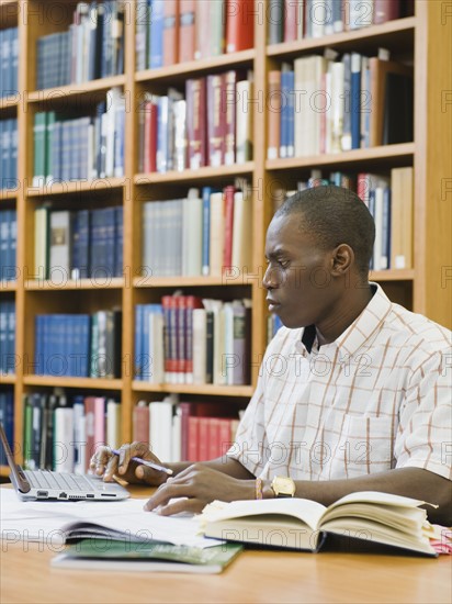 College student working in library.