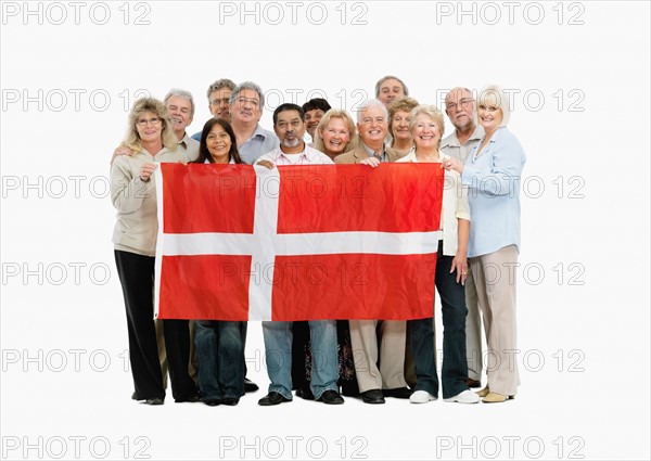 Group of people holding the flag of South Africa. Photo : momentimages