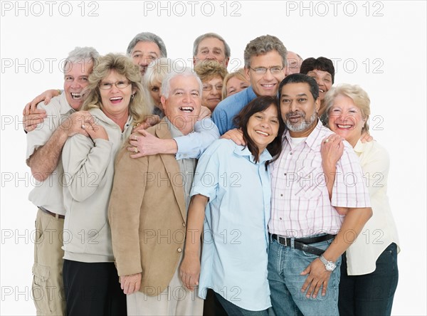 A group of people embracing. Photo : momentimages