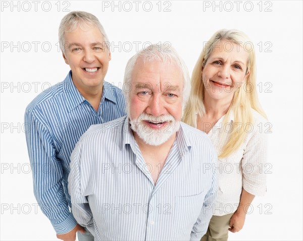 Three smiling people. Photo : momentimages