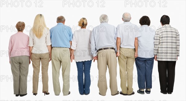 Rear view of people standing in a row. Photo : momentimages