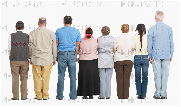 Rear view of people standing in a row. Photo : momentimages