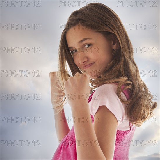 Pretty teenage girl holding her fists up. Photo : Mike Kemp