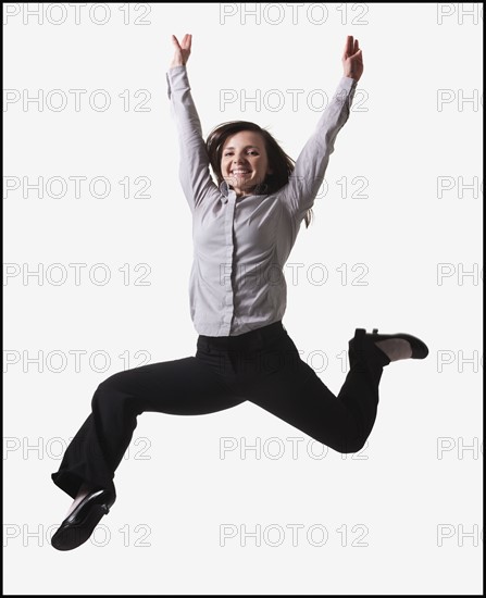 Businesswoman jumping for joy. Photo : Mike Kemp