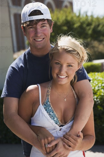 Teenage couple embracing. Photo : Stewart Cohen