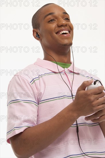 Laughing man wearing earphones. Photo : K.Hatt