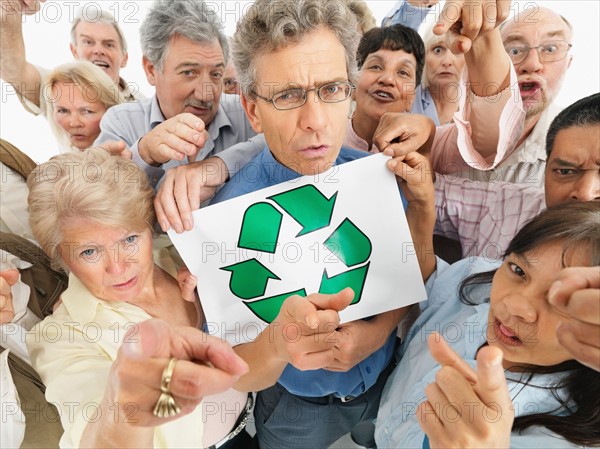 A group of people pointing their fingers. Photo : momentimages