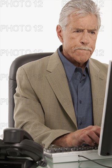 Businessman working on computer. Photo : K.Hatt