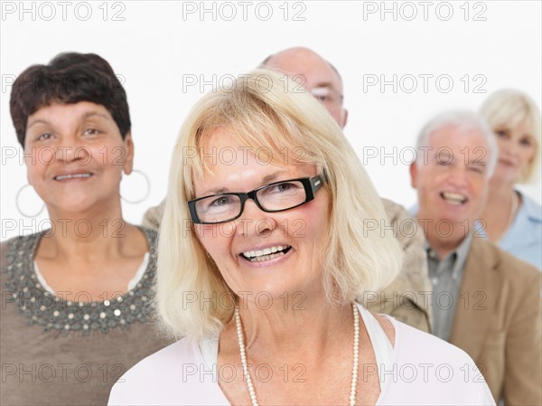 A group of smiling people. Photo : momentimages