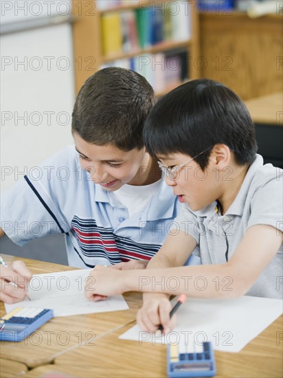 Students doing math work in classroom.