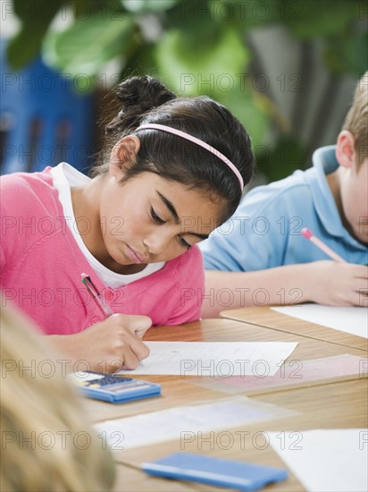 Students doing math work in classroom.