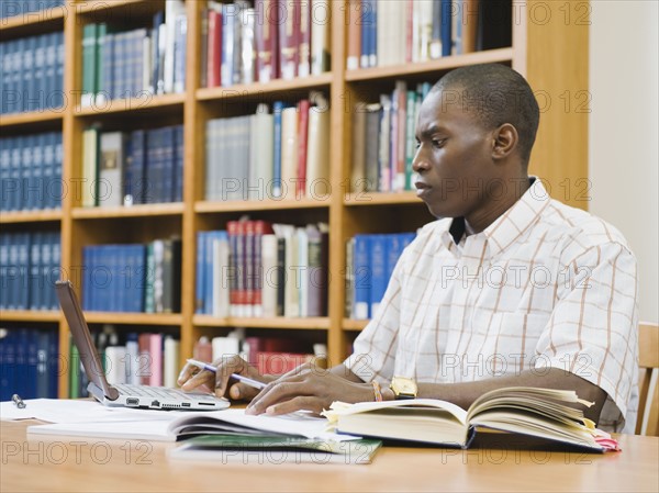 College student working in library.