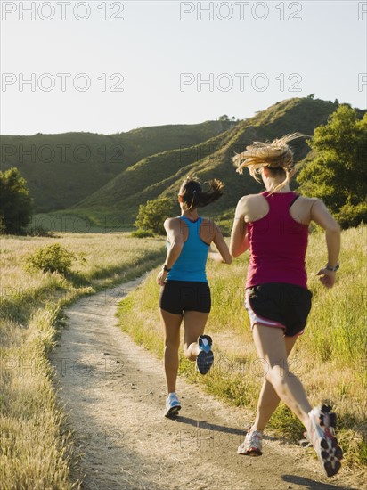 Two female trail runners.