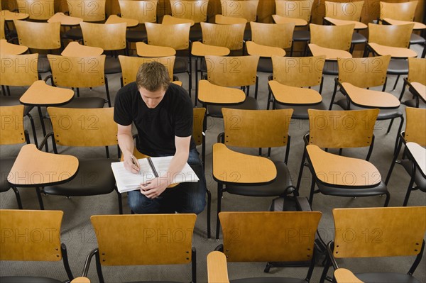 Last student left in college lecture hall.