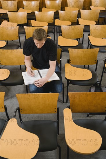 Last student left in college lecture hall.