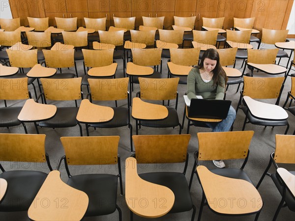 Last student left in college lecture hall.