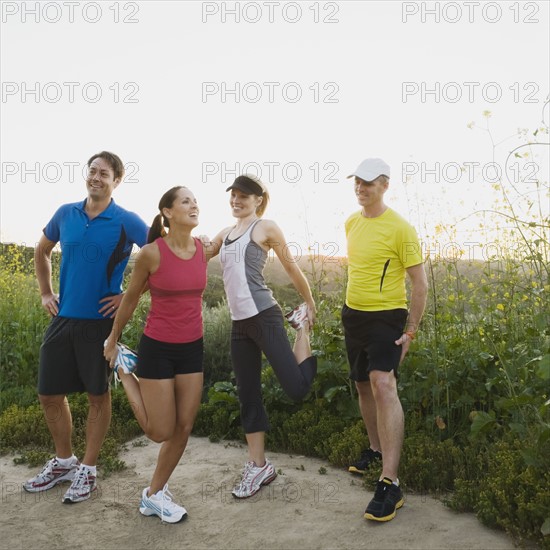 Trail runners stretching.