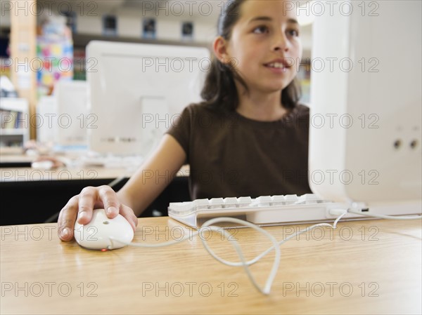 Student working on computer in classroom.