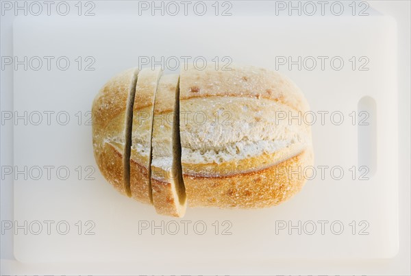 Freshly sliced bread on cutting board. Photo : Jamie Grill
