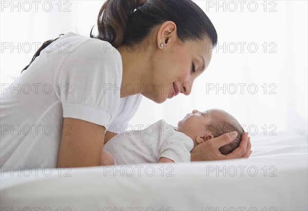 Mother sharing a tender moment with her baby.