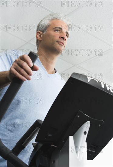 Man exercising on Stairmaster.