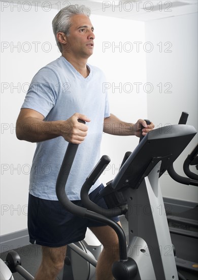 Man exercising on Stairmaster.