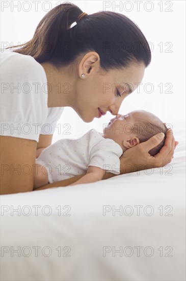 Mother holding her sleeping baby.