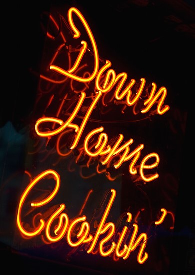 Illuminated Down Home Cookin' sign.