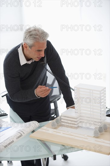 Architect talking on phone.