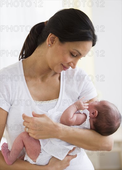 Mother holding her baby.