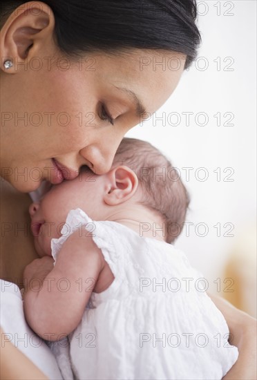 Mother holding her baby.