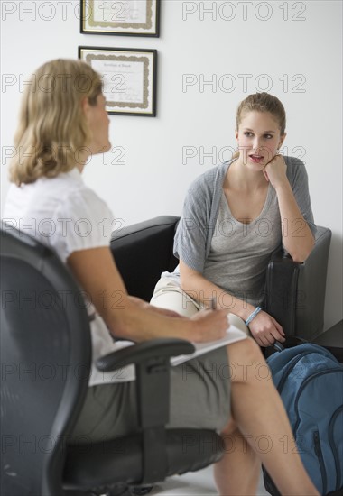 Psychiatrist and patient in counseling session.