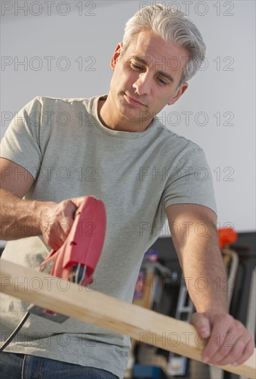 Handyman using an electric drill.