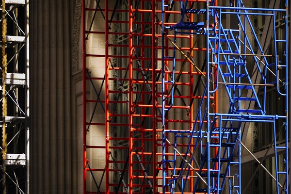 Scaffolding beside high-rise buildings.