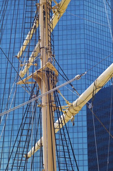 Peking mast in front of high-rise building at South Street seaport.