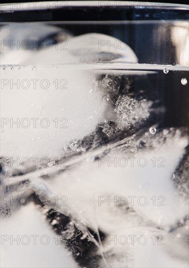 Glass of water and ice cubes. Photo : Jamie Grill