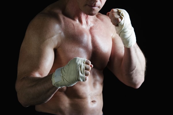 Boxer with taped hands. Photo : Daniel Grill