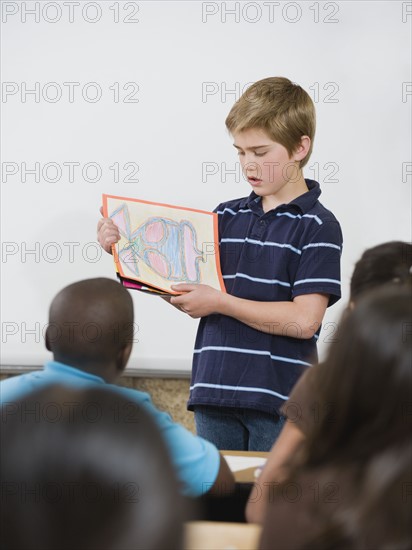 Elementary student giving class presentation.