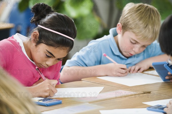 Students doing math work in classroom.