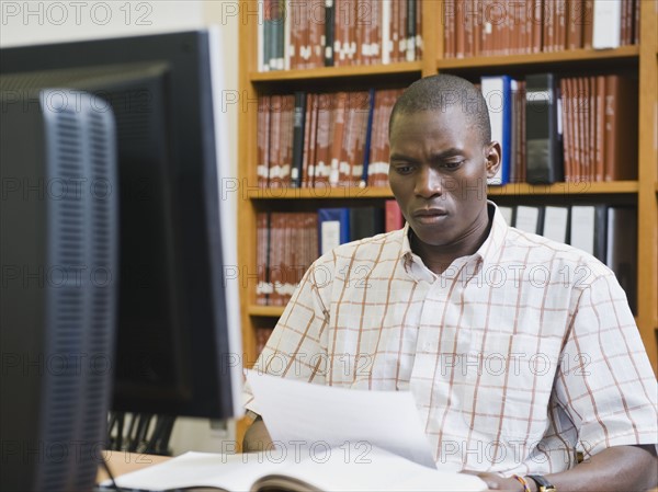 College student working in library.