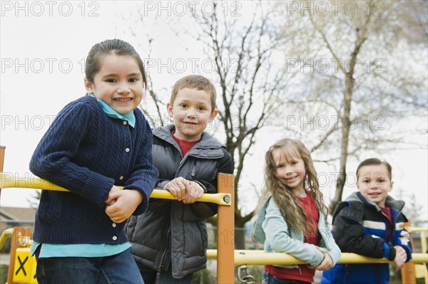 Elementary school students playing in playground at recess.
