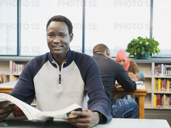 Adult sitting at desk at learning center.