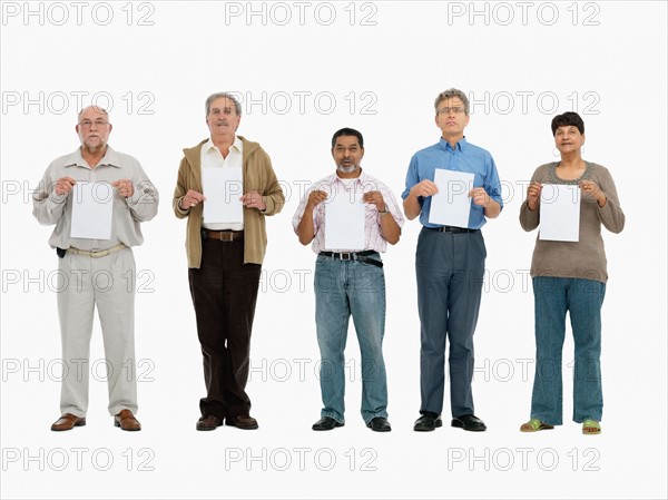 Group of people standing in a row holding papers. Photo : momentimages